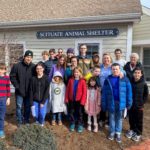 Group photo of parents and children outside of the Scituate Animal Shelter.