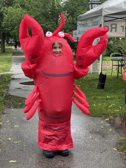 Person dressed in red lobster "mascot" costume
