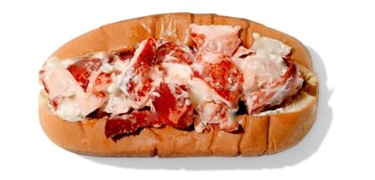 horizontal hot dog shaped roll stuffed with lobster meat mixed with lite mayonnaise,