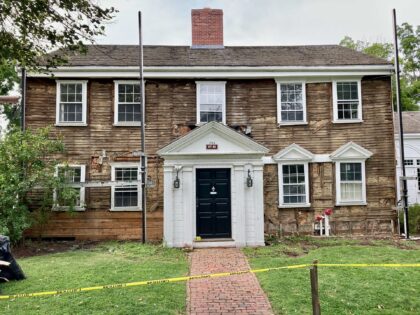 The front of the Parish House with the old clapboards revealed