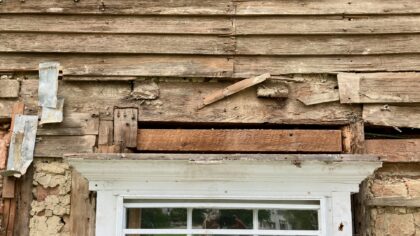 Close-up of framing and clapboards over a window