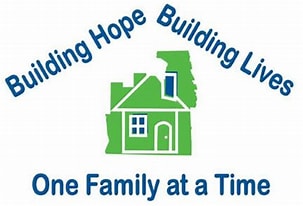 Green house in the center of words about Building Hope One Family at a Time